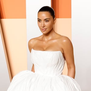 Kim Kardashian attends the 2025 Vanity Fair Oscar Party in a white ballgown.