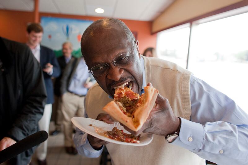 galleries/2011/09/20/herman-cain-sarah-palin-and-more-politicians-eating-pizza-photos/pols-pizza-cain_h3z2lo