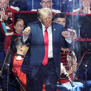 U.S. President Donald Trump gestures as the United States Marine Band performs at a rally to kick off the Great American State Fair in celebration of the 250th anniversary of U.S. independence on the National Mall in Washington, D.C., U.S., June 24, 2026. REUTERS/Evelyn Hockstein REFILE - QUALITY REPEAT     TPX IMAGES OF THE DAY