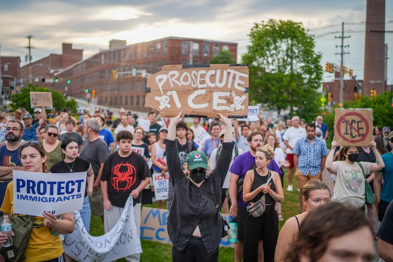 Anti-ICE protesters attend a vigil for a man that was killed in a shooting involving U.S. Immigration and Customs Enforcement (ICE)