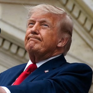 U.S. President Donald Trump looks on as he delivers remarks in the Memorial Amphitheater during a Memorial Day event at Arlington National Cemetery, Arlington, Virginia, U.S., May 25, 2026.