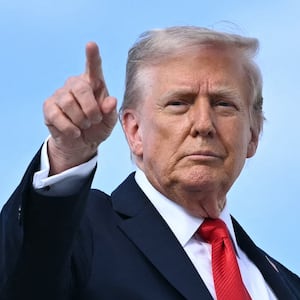 US President Donald Trump points as he boards Air Force One at Joint Base Andrews, Maryland, on September 11, 2025.
