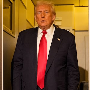 President Donald Trump prepares to speak to members of the media aboard Air Force One on October 30, 2025 in flight.