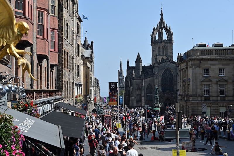 EDINBURGH, SCOTLAND - AUGUST 13: Crowds of festival-goers and tourists throng the Royal Mile during the Edinburgh Festival Fringe, on August 13, 2025 in Edinburgh, Scotland. Billed as the world's greatest platform for creative freedom, for three weeks each August, Edinburgh welcomes an explosion of creative energy from around the globe as artists and performers take part in the Edinburgh Fringe Festival, presenting shows that span many genres including cabaret, children's shows, comedy, dance, physical theatre, circus, music, musicals, opera and theatre. (Photo by Ken Jack/Getty Images)