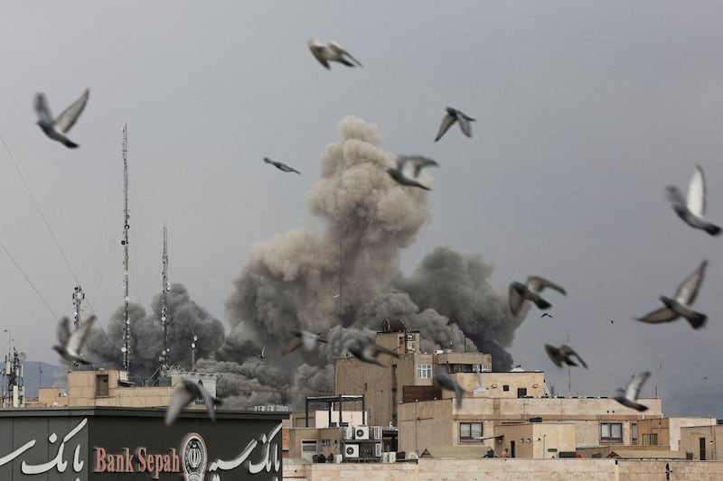 Birds fly as smoke rises following an explosion, after Israel and the U.S. launched strikes on Iran, amid the U.S.-Israel conflict with Iran, in Tehran, Iran, March 2, 2026.
