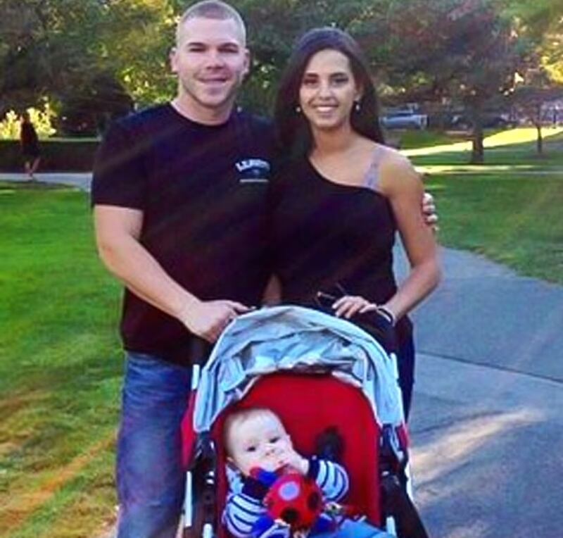 Michael Leavitt, Bruna Ferreira, and their son in an undated image posted to social media.