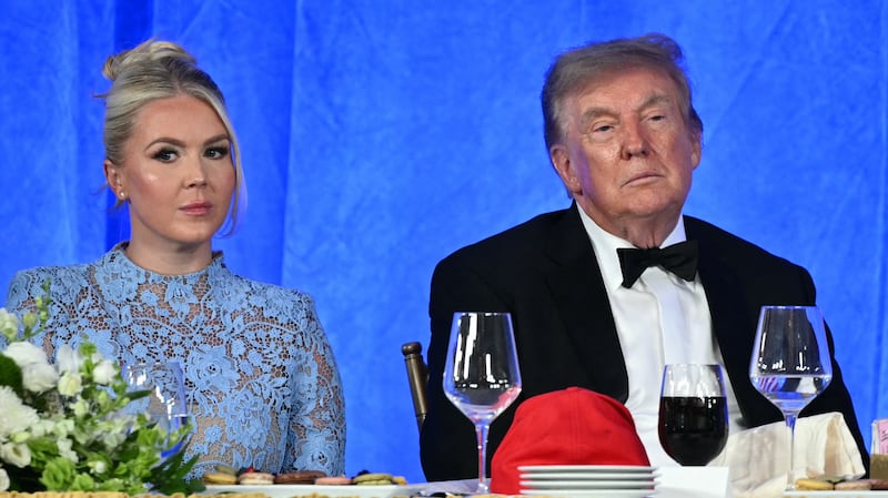 White House Press Secretary Karoline Leavitt and US President Donald Trump watch Oz 'Oz the Mentalist' Pearlman perform during the 2026 White House Correspondents' Association (WHCA) Dinner at the Waldorf Astoria in Washington, DC, on July 24, 2026. The 2026 WHCA Dinner was originally scheduled for April 25 at the Washington Hilton, but was rescheduled and relocated after an alleged gunman breached security. (Photo by Mandel NGAN / AFP via Getty Images)
