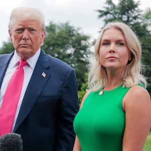 President Donald Trump, joined by White House Press Secretary Karoline Leavitt, speaks to the media as he departs the White House on July 15, 2025 in Washington, DC.