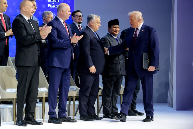 President Donald Trump greets Prime minister of Hungary Viktor Orbán as he presents the “Board of Peace” onstage at the World Economic Forum (WEF) on January 22, 2026 in Davos, Switzerland.