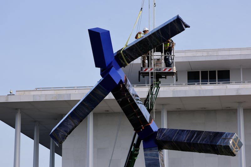 Crews work to remove the sculpture titled "Blue" by artist Joel Shapiro from the grounds of The Kennedy Center for the Performing Arts, after it was targeted for removal by the Trump administration, in Washington, D.C. on September, 2, 2026.