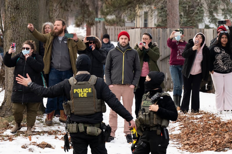 MINNEAPOLIS, MINNESOTA - FEBRUARY 05: Observers film ICE agents as they hold a perimeter after one of their vehicles got a flat tire on Penn Avenue on February 5, 2026 in Minneapolis, Minnesota. Protests continue calling for an end to immigration raids in the Twin cities which have already resulted in the fatal shooting deaths of Alex Pretti, a VA nurse, and Renee Good, a mother of three, by federal agents. (Photo by Stephen Maturen/Getty Images)