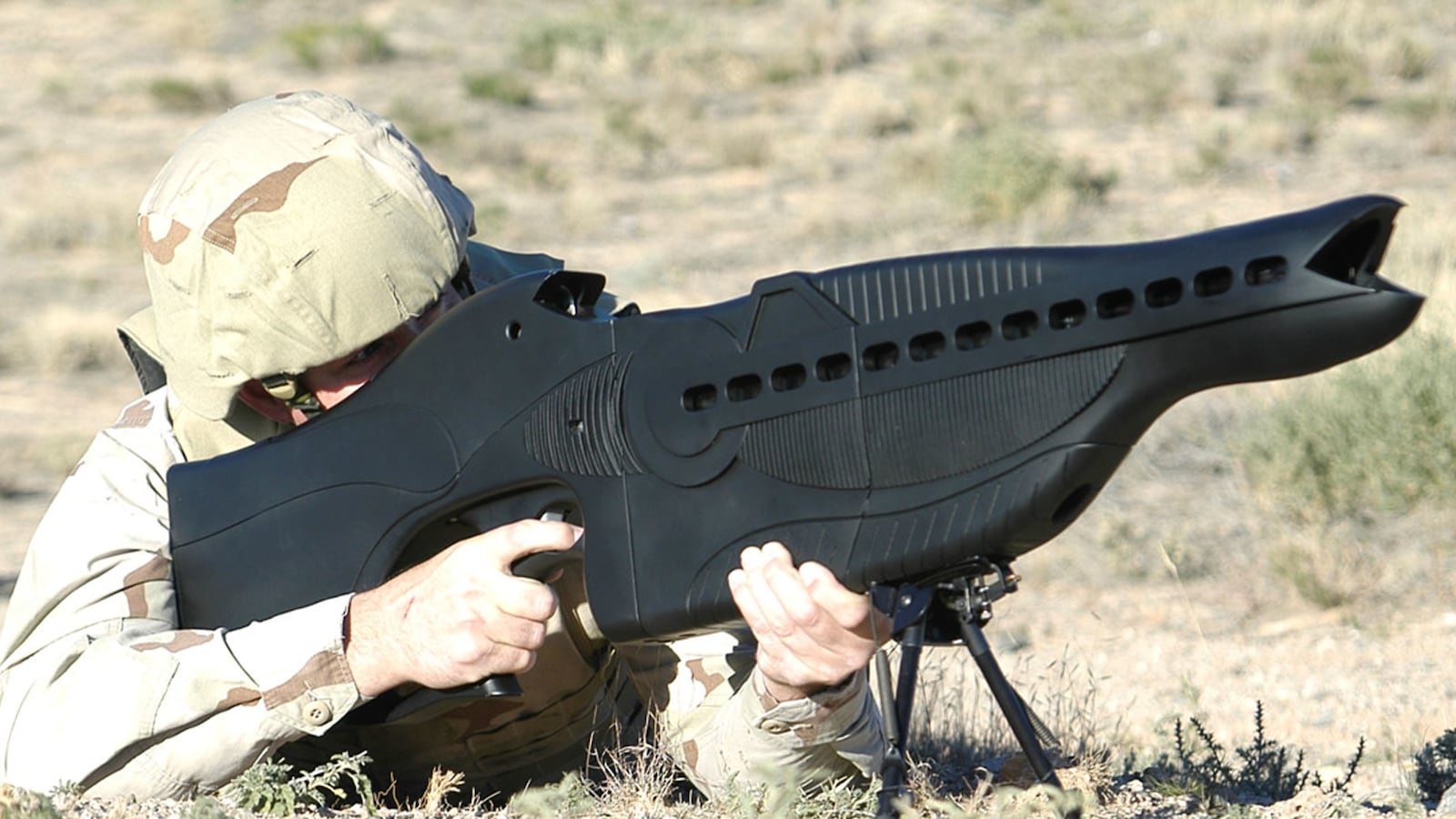 articles/2014/04/09/laser-rifles-canine-air-conditioners-hidden-armor-and-other-cool-gear-on-america-s-commando-wish-list/140408-peck-secret-weapons-tease_qxscqb