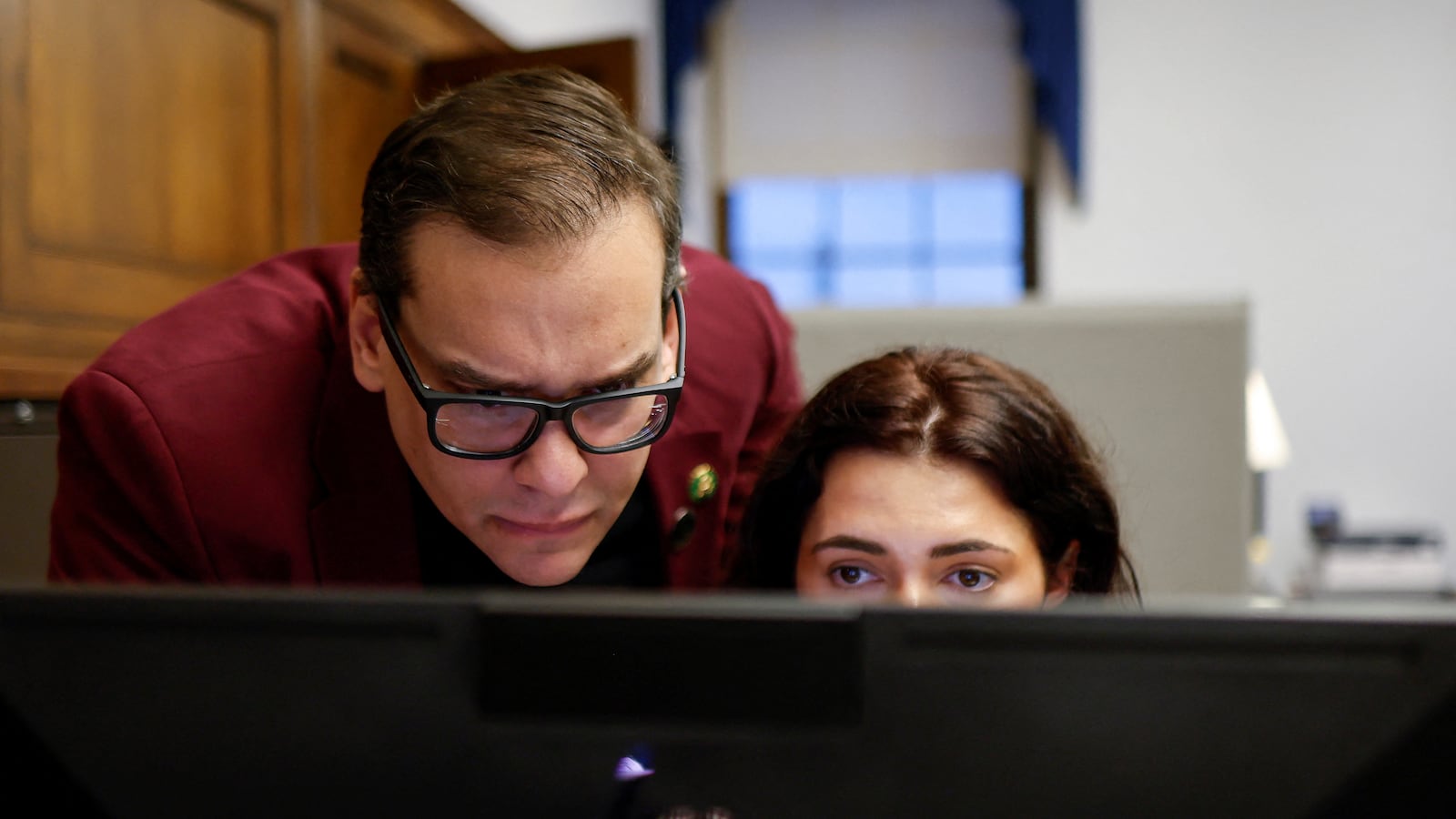 U.S. Representative George Santos (R-NY) talks with his Press Secretary Gabrielle Lipsky.