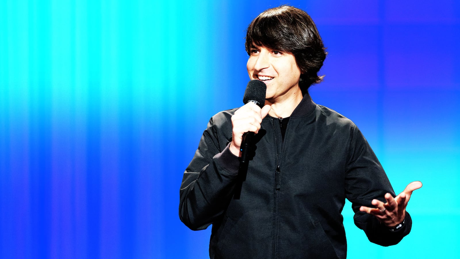 An illustration including a photo of Demetri Martin