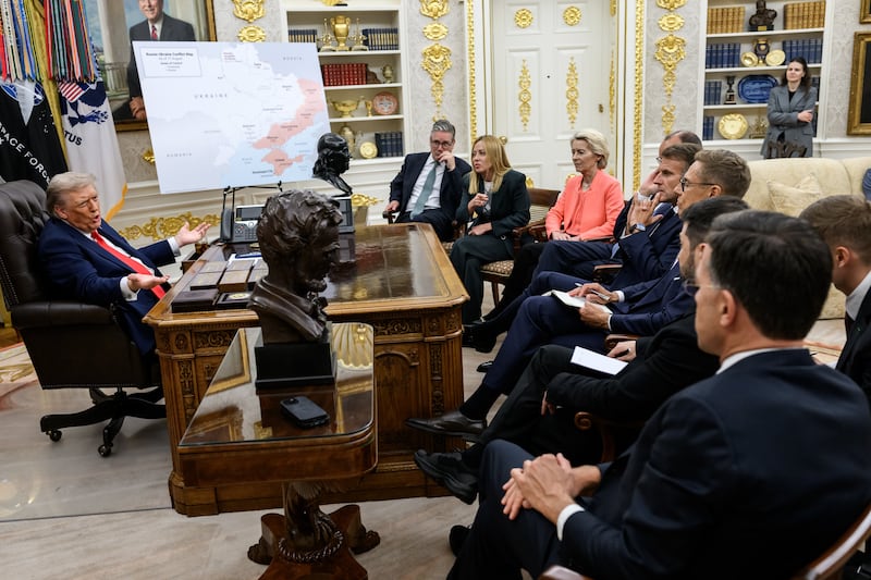 The real photo, showing a map of Ukraine as President Donald Trump meets with European leaders in August.