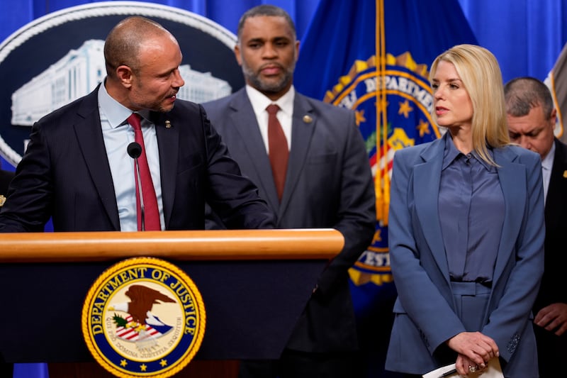 FBI Deputy Director Dan Bongino and Attorney General Pam Bondi during a news conference on an arrest of a suspect in the January 6th pipe bombing case at the Department of Justice on December 4, 2025 in Washington, DC.