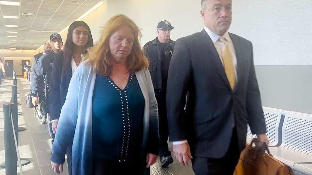 Asa Ellerup, wife of Gilgo Beach suspect Rex Heuermann, walks into the courtroom in Riverhead, New York with her lawyer, Bob Macedonio, on Nov. 15, 2023.