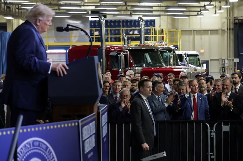 Texas Attorney General Ken Paxton, candidate for US Senate, waves as US President Donald Trump speaks during his visit to Peterbilt Motors in Denton, Texas, US, October 1, 2026.