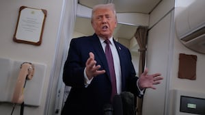IN FLIGHT - JANUARY 22: U.S. President Donald Trump speaks to reporters on board Air Force One while flying in between Ireland and Washington as he returns from the World Economic Forum on January 22, 2026. Following a meeting with NATO Secretary General Mark Rutte, Trump announced a deal with European leaders on the semi-autonomous Danish territory of Greenland during the annual meeting of political and business leaders in Davos. (Photo by Chip Somodevilla/Getty Images)