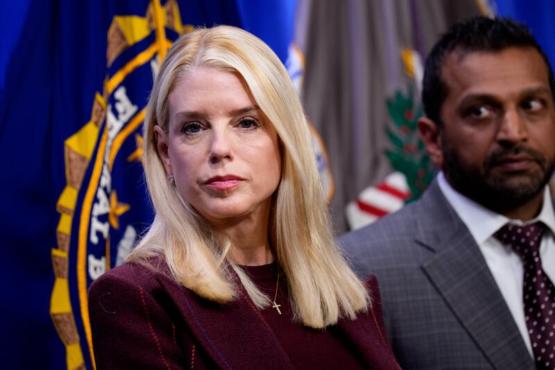 Attorney General Pam Bondi and FBI Director Kash Patel (R) appear during a news conference announcing the indictment of a former Olympic snowboarder Ryan Wedding, charging him with murder and money laundering in connection to a drug trafficking organization at the Justice Department on November 19, 2025 in Washington, DC.