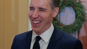 Sen. Josh Hawley (R-MO) talks with friends before attending the weekly Senate Republican policy luncheon the U.S. Capitol on December 09, 2025 in Washington, DC.
