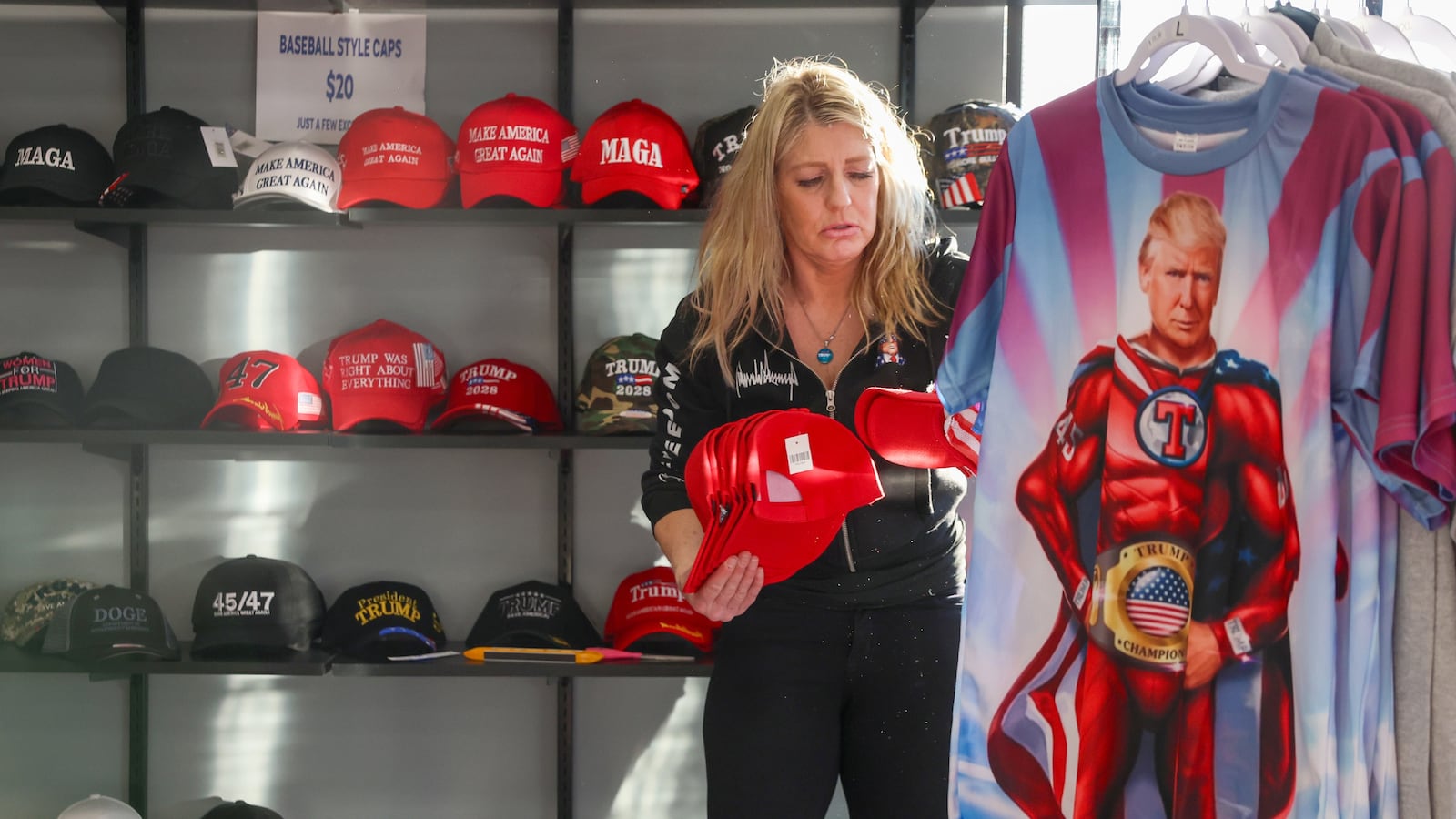 Lisa Fleischmann dozens of hats in her soon-to-open store, the Trump Truth Store and Hangout, on Jan. 13, 2026, in Crystal Lake. The store features pro-Trump t-shirts, hats, glass ware, flags, and many other items. (Stacey Wescott/Chicago Tribune/Tribune News Service via Getty Images)