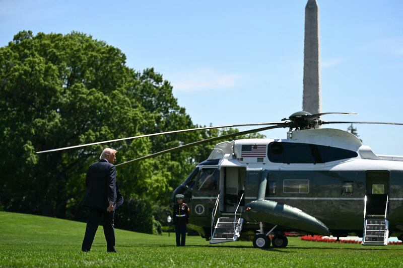 President Donald Trump walks to board Marine One as he departs from the South Lawn of the White House in Washington, DC, on May 12, 2026.