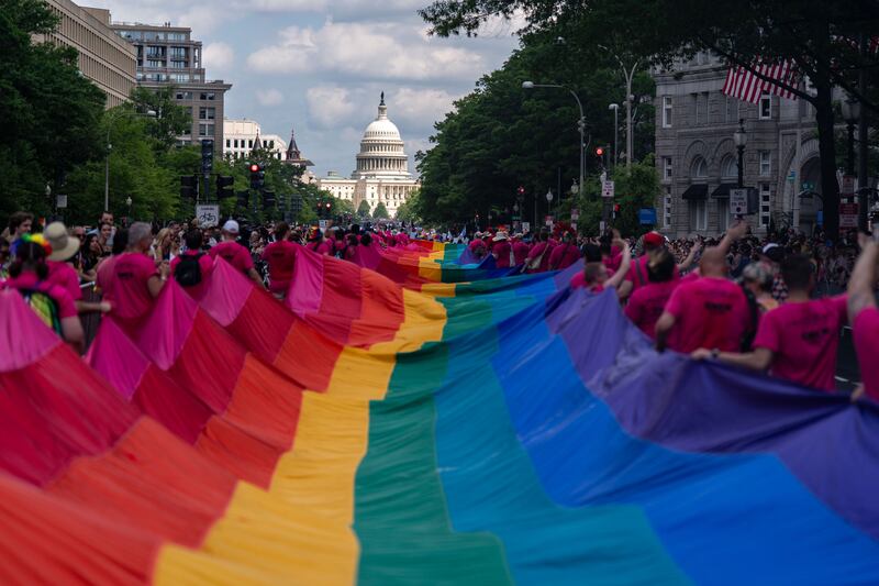 WASHINGTON, DC - JUNE 7: Activists with the Gilbert Baker Foundation carry a 1,000-foot Rainbow Flag along the parade route during the WorldPride 2025 Celebrations on June 7, 2025 in Washington, DC. This year Washington, DC is the host city for the annual WorldPride, a global celebration of the LGBTQ community. 2025 marks the 50th Anniversary of Pride celebrations in Washington, DC. (Photo by Kent Nishimura/Getty Images)