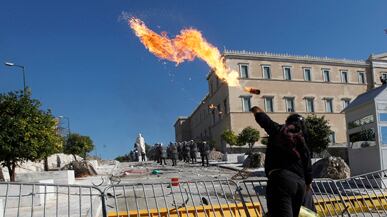 cheats/2011/10/19/greece-proceeds-on-austerity/greece-protest-flame-cheat_v6wgca