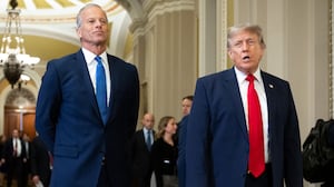 US President Donald Trump walks with Senate Majority Leader John Thune, Republican from South Dakota, on the way to a lunch meeting with Senate Republicans at the US Capitol in Washington, DC, on June 24, 2026. President Trump said Wednesday he will refuse to sign a landmark housing bill, passed by Congress with broad bipartisan support, until lawmakers approve legislation that would overhaul American elections and restrict voter registration. (Photo by SAUL LOEB / AFP via Getty Images)