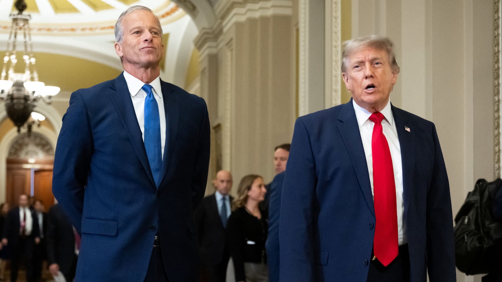 US President Donald Trump walks with Senate Majority Leader John Thune, Republican from South Dakota, on the way to a lunch meeting with Senate Republicans at the US Capitol in Washington, DC, on June 24, 2026. President Trump said Wednesday he will refuse to sign a landmark housing bill, passed by Congress with broad bipartisan support, until lawmakers approve legislation that would overhaul American elections and restrict voter registration. (Photo by SAUL LOEB / AFP via Getty Images)