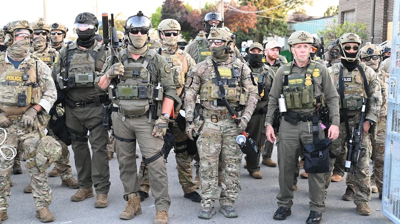 Border Patrol Chief Gregory Bovino of the El Centro Sector stands amid a protest outside an ICE facility