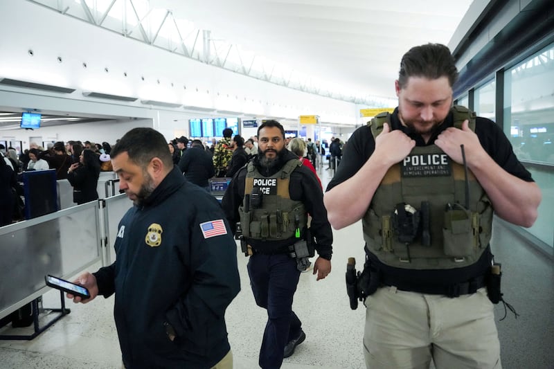 Immigration and Customs Enforcement (ICE) agents patrol at John F. Kennedy International Airport, New York City, U.S. March 23, 2026. Hundreds of Immigration and Customs Enforcement agents were ordered to deploy to airports to help fill TSA staffing gaps across the country. REUTERS/Adam Gray     TPX IMAGES OF THE DAY