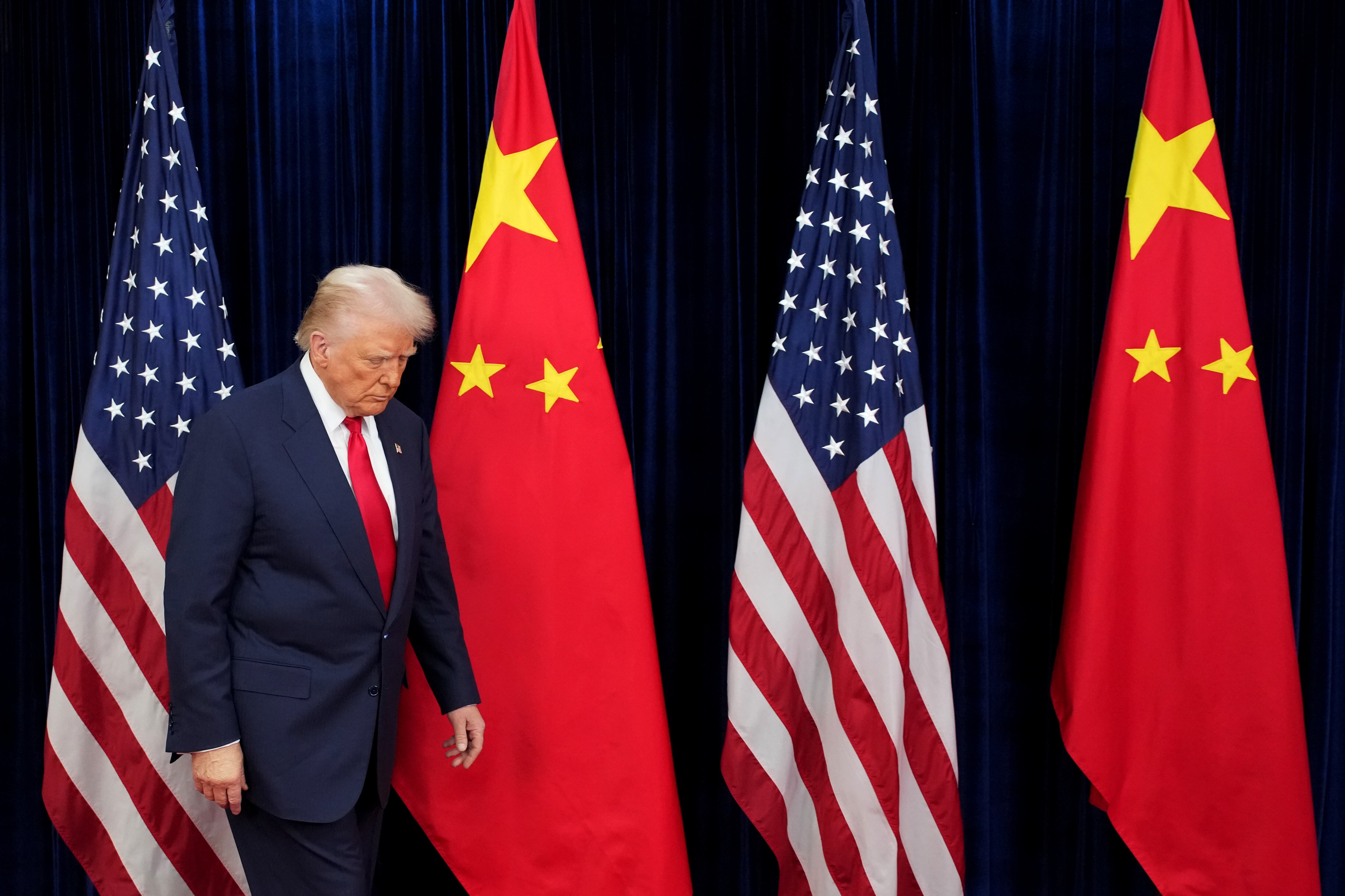 U.S. President Donald Trump prepares to greet Chinese President Xi Jinping ahead of a bilateral meeting at Gimhae Air Base on October 30, 2025 in Busan, South Korea.