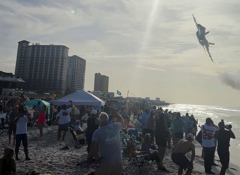 A Navy Blue Angels jet flies low over the crowd on Pensacola Beach, in Florida, U.S., July 15, 2026, in this screengrab obtained from a social media video. Partridge Drones via Facebook/via REUTERS  THIS IMAGE HAS BEEN SUPPLIED BY A THIRD PARTY. MANDATORY CREDIT. NO RESALES. NO ARCHIVES. THIS PICTURE WAS PROCESSED BY REUTERS TO ENHANCE QUALITY. AN UNPROCESSED VERSION HAS BEEN PROVIDED SEPARATELY.  VERIFICATION:  - Pier, beach and buildings matched archive and satellite images - Location and date also verified by original file metadata     TPX IMAGES OF THE DAY