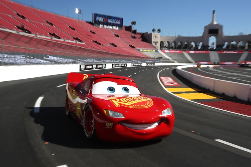 LOS ANGELES, CALIFORNIA - FEBRUARY 04: A replica of Lightning McQueen from the movie Cars drives the track during previews for the NASCAR Cup Series Busch Light Clash at Los Angeles Memorial Coliseum on February 04, 2022 in Los Angeles, California. (Photo by Sean Gardner/Getty Images)