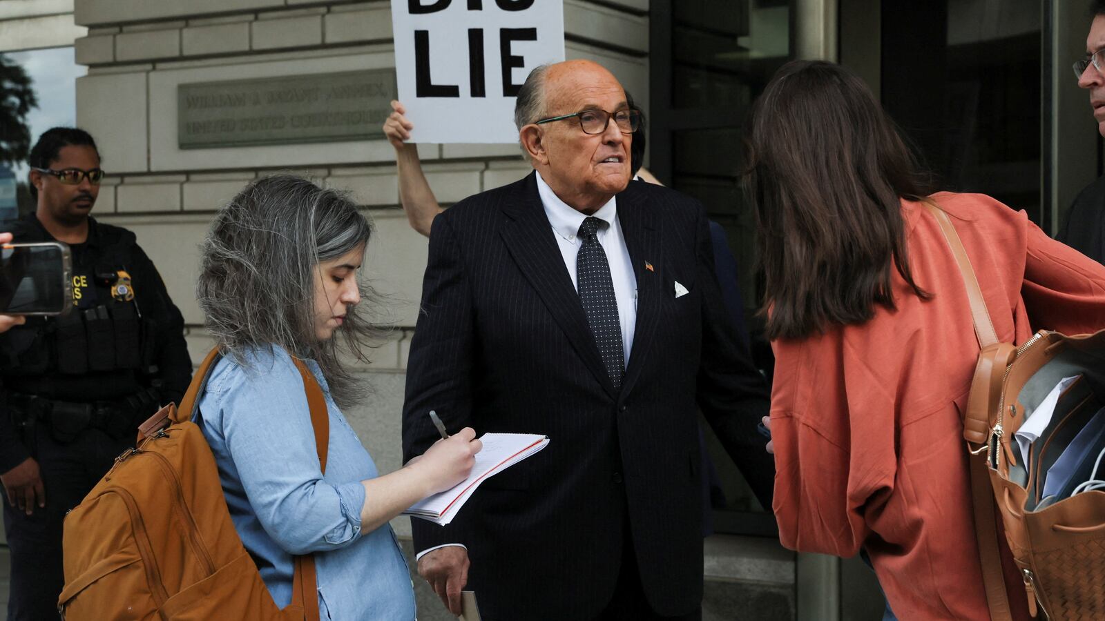 Rudy Giuliani exits U.S. District Court.