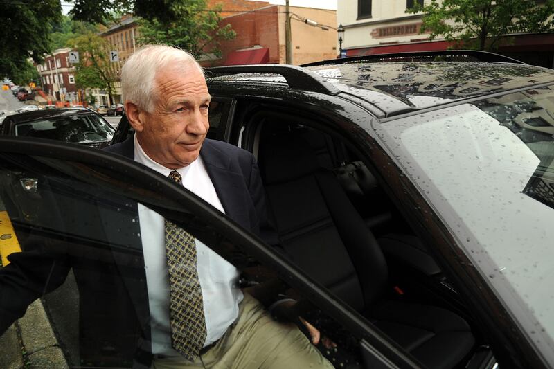 articles/2012/06/05/the-sandusky-sexual-abuse-case-s-biggest-mysteries/sandusky-walk-up-dimond_natgzm