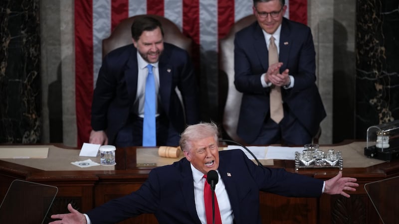 Donald Trump, with JD Vance and Speaker of the House Mike Johnson looking on, delivers his State of the Union address during a Joint Session of Congress at the U.S. Capitol on February 24, 2026.