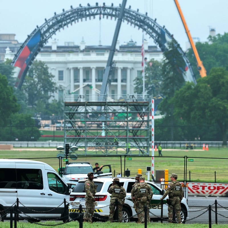 U.S. Army National Guard soldiers patrol nearby as construction is underway on a temporary arena that will host the UFC Freedom 250 fight card in June on the South Lawn of the White Hous