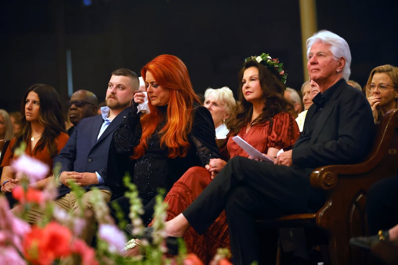 Wynonna Judd, Ashley Judd, and Larry Strickland attend CMT and Sandbox Live's "Naomi Judd: A River Of Time Celebration" in 2022.