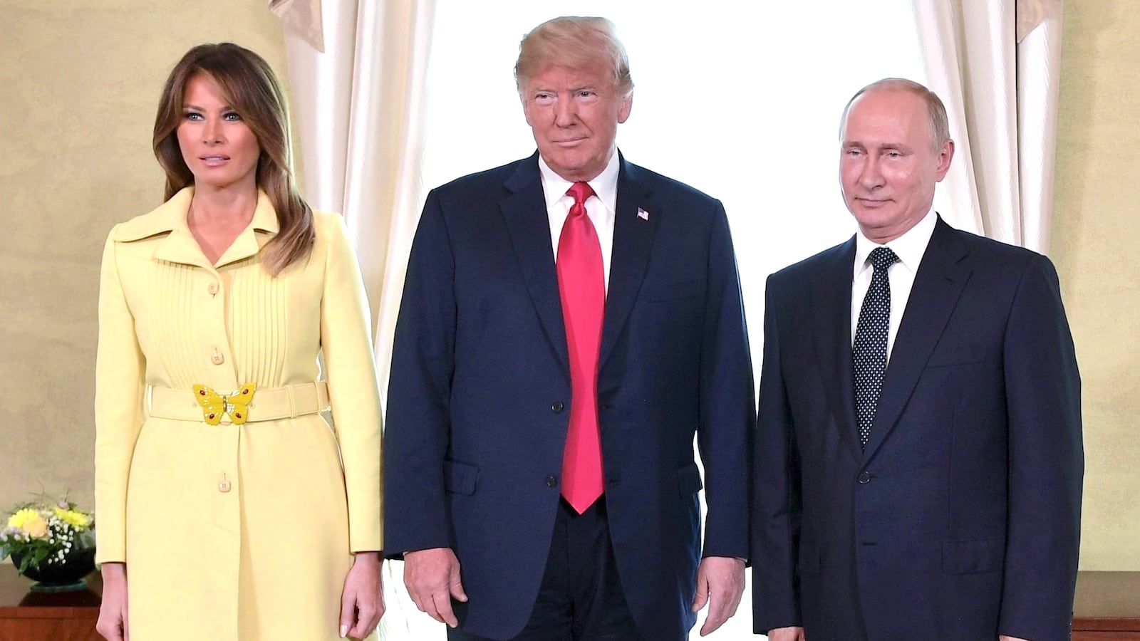 US President Donald Trump (C), Russia's President Vladimir Putin and US First Lady Melania Trump