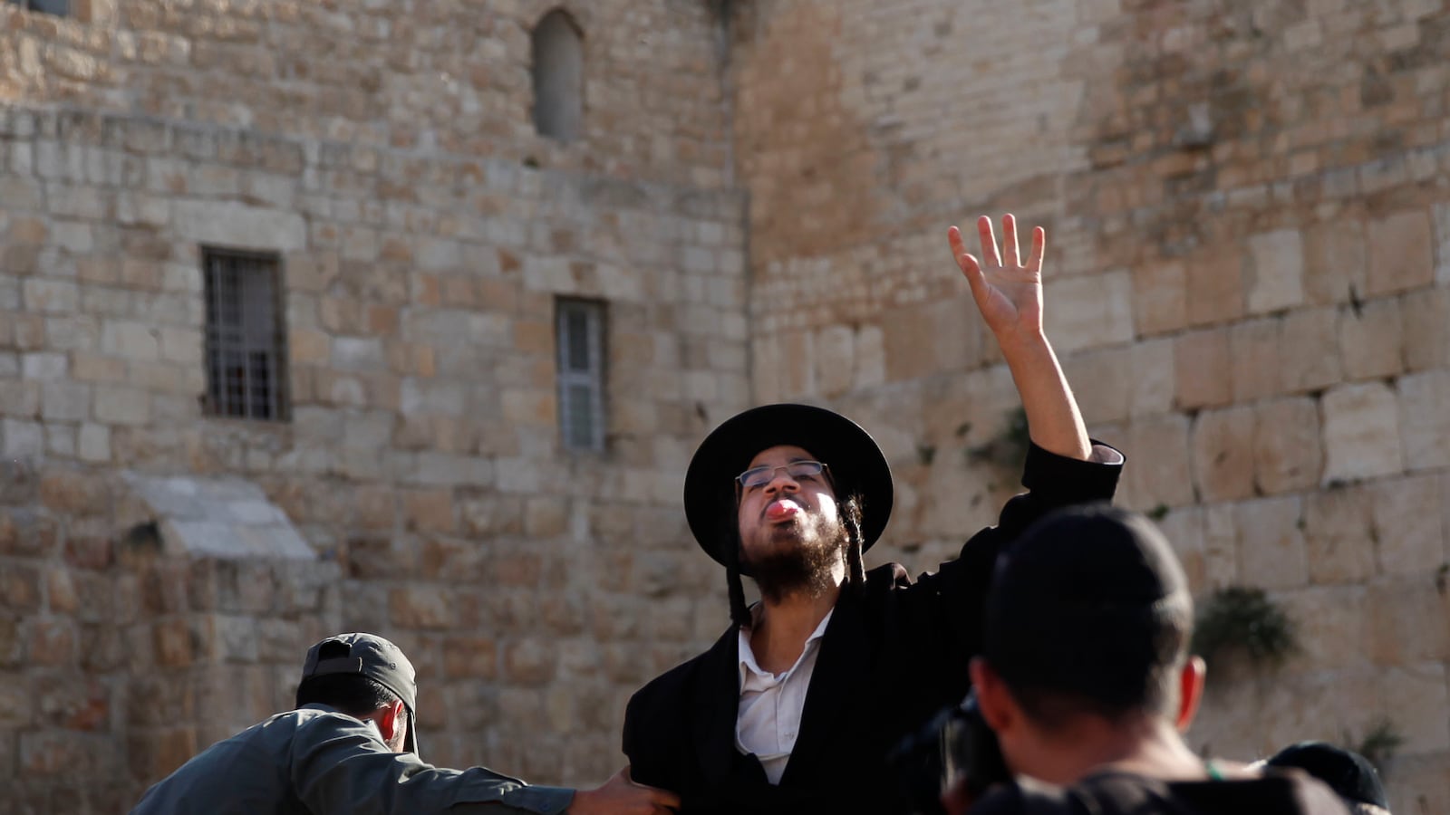 articles/2013/05/14/shavout-and-self-immolation/kotel-hate-openz_mm6pf3