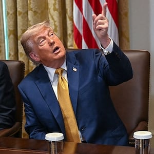 President Donald Trump (C) makes comments about new decor in the room as Secretary of Defense Pete Hegseth (R) and Secretary of State Marco Rubio (L) look on during a cabinet meeting in the Cabinet Room of the White House in Washington, DC, on July 8, 2025. (Photo by ANDREW CABALLERO-REYNOLDS / AFP) (Photo by ANDREW CABALLERO-REYNOLDS/AFP via Getty Images)