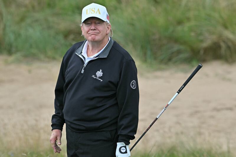 US President Donald Trump reacts after playing from the first tee to officially open the Trump International Golf Links course in Balmedie, Aberdeenshire, north east Scotland on July 29, 2025. (Photo by ANDY BUCHANAN / AFP) (Photo by ANDY BUCHANAN/AFP via Getty Images)