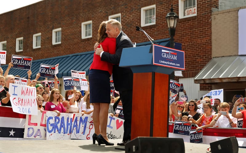 Republican presidential candidate U.S. Senator Lindsey Graham hugs his sister Darline Graham Nordone after she introduced him to formally announce his campaign for the 2016 Republican presidential nomination in his hometown Central, South Carolina June 1, 2015.
