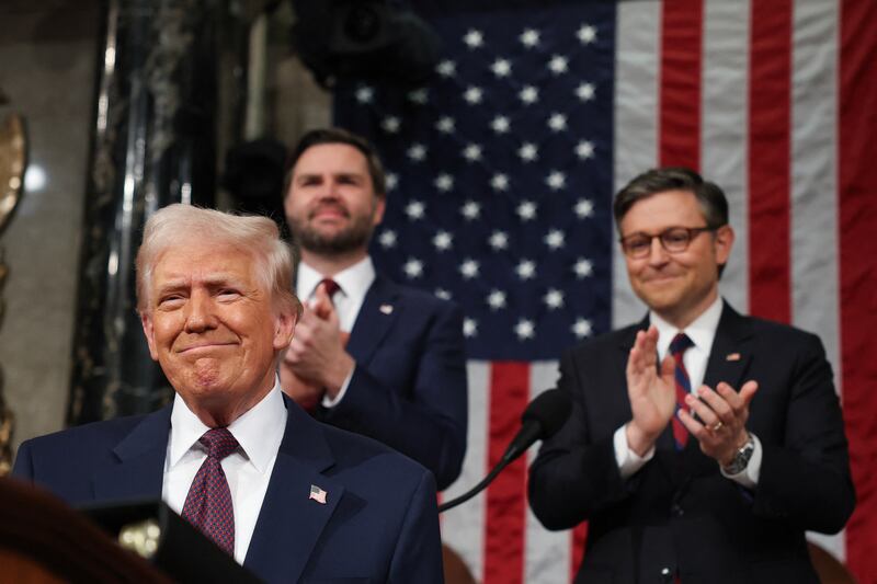 US Speaker of the House Mike Johnson (R-LA) and Vice President JD Vance applaud as US President Donald Trump