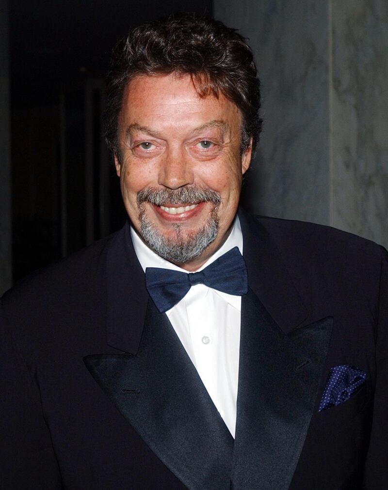Actor Tim Curry poses as he arrives during the 5th Annual Costume Designers Guild Awards March 16, 2003 in Beverly Hills, California.