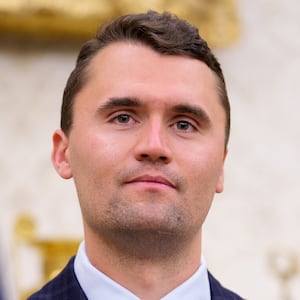 WASHINGTON, DC - MAY 28: Turning Point USA co-founder Charlie Kirk stands in the back of the room as U.S. President Donald Trump speaks during a swearing in ceremony for interim U.S. Attorney for Washington, D.C. Jeanine Pirro in the Oval Office of the White House on May 28, 2025 in Washington, DC. Trump has announced Pirro, a former Fox News personality, judge, prosecutor, and politician, after losing support in the Senate for his first choice, Ed Martin, over his views on the January 6, 2021 attack on the U.S. Capitol.