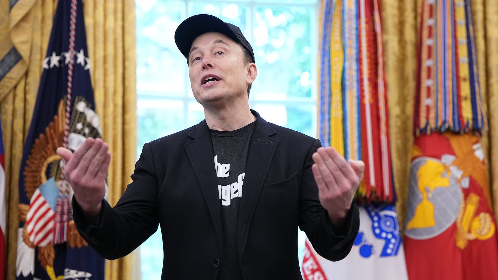 Tesla CEO Elon Musk speaks alongside U.S. President Donald Trump in the Oval Office of the White House